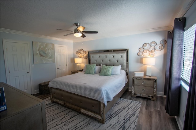 bedroom featuring a textured ceiling, dark hardwood / wood-style flooring, ceiling fan, and ornamental molding