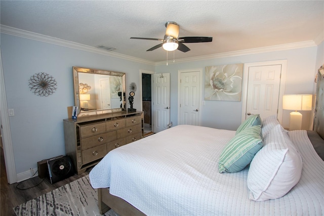 bedroom featuring a textured ceiling, ceiling fan, ornamental molding, and dark wood-type flooring