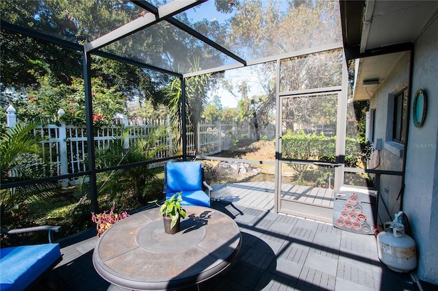 view of patio featuring a lanai