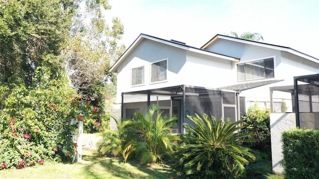 view of side of home featuring a lanai