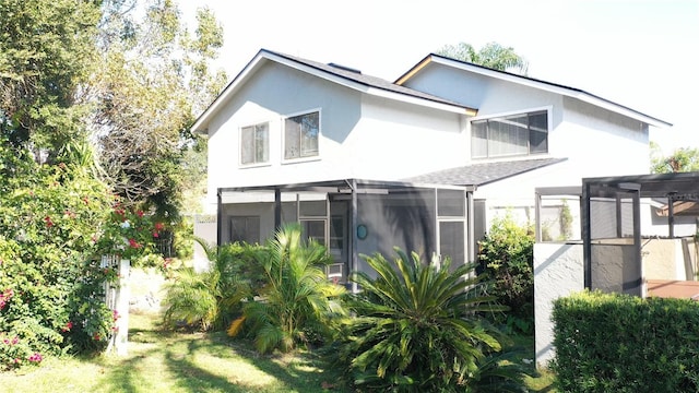 back of property featuring a sunroom