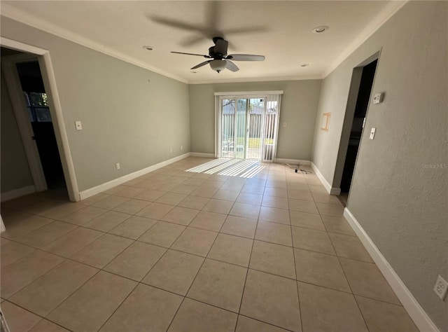 empty room with crown molding, ceiling fan, and light tile patterned flooring