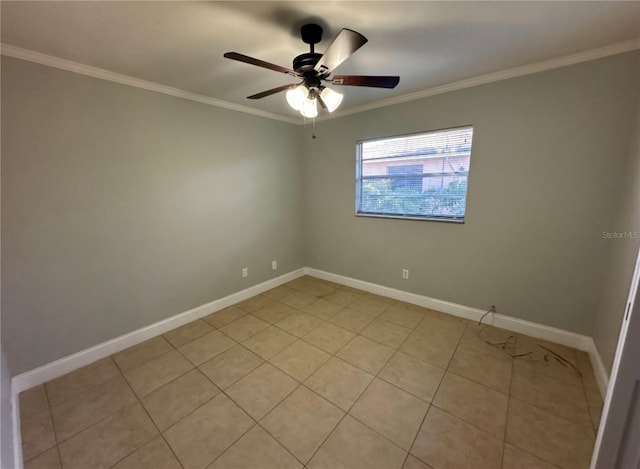 tiled spare room featuring ceiling fan and ornamental molding