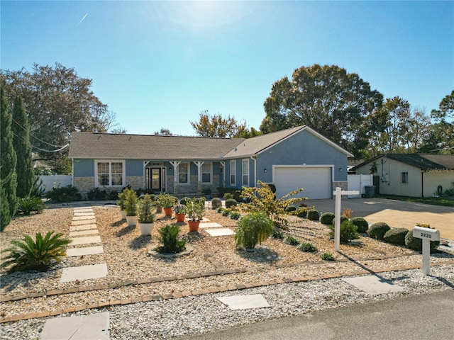 ranch-style house featuring a garage