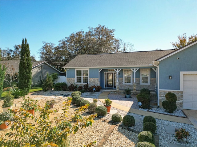 ranch-style house featuring a garage