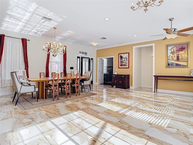 dining area featuring crown molding and ceiling fan with notable chandelier