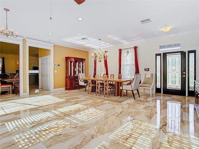 dining room featuring crown molding and a chandelier