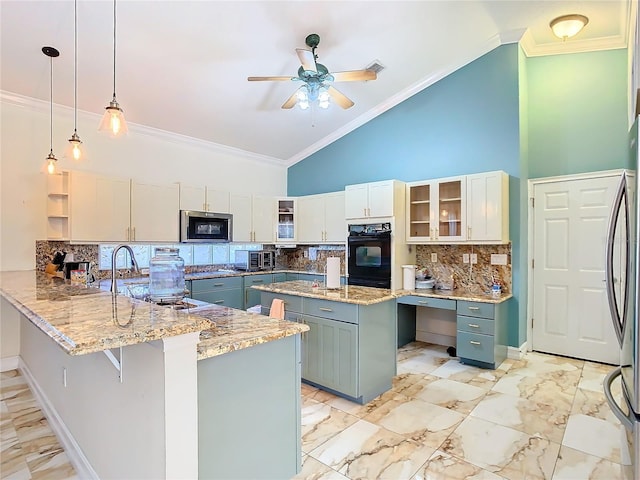 kitchen with kitchen peninsula, appliances with stainless steel finishes, pendant lighting, high vaulted ceiling, and white cabinets