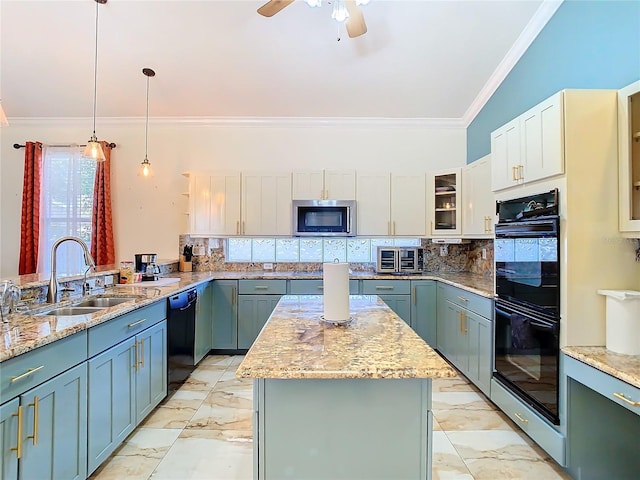 kitchen with sink, lofted ceiling, decorative light fixtures, a kitchen island, and black appliances