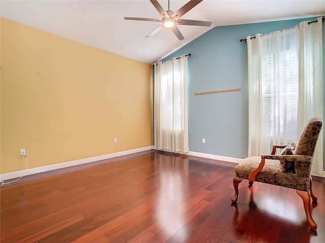 living area with hardwood / wood-style flooring, vaulted ceiling, plenty of natural light, and ceiling fan