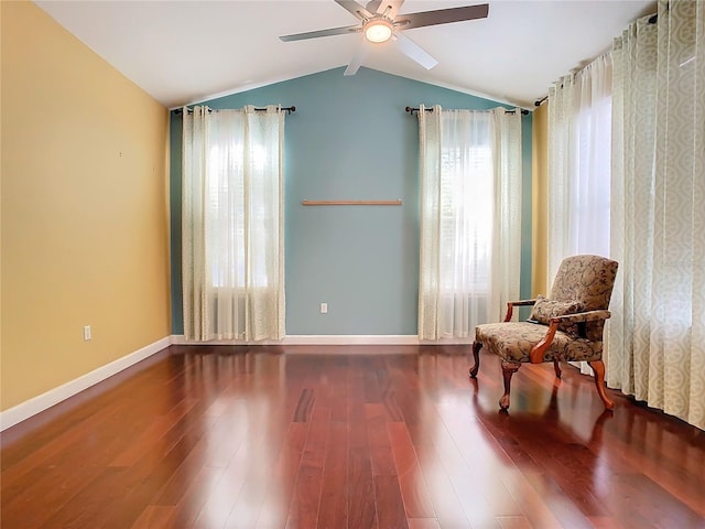 sitting room with hardwood / wood-style floors, ceiling fan, and lofted ceiling