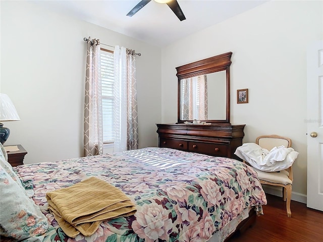 bedroom featuring ceiling fan and dark wood-type flooring