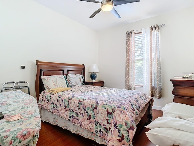 bedroom featuring dark hardwood / wood-style floors and ceiling fan