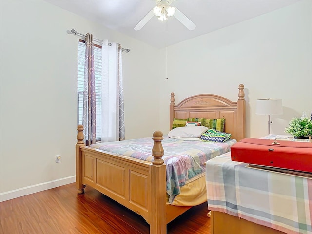 bedroom with ceiling fan and dark wood-type flooring