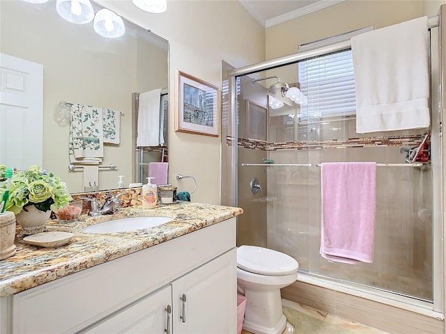 bathroom featuring an enclosed shower, vanity, crown molding, wood-type flooring, and toilet