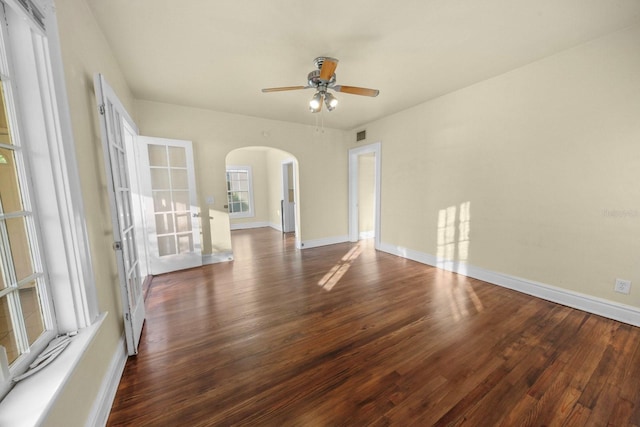 spare room featuring ceiling fan and dark hardwood / wood-style flooring