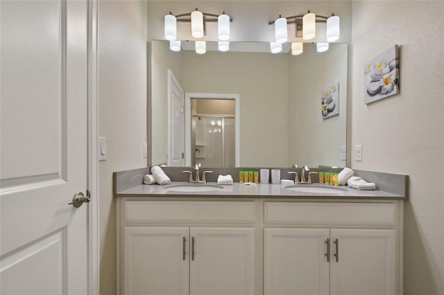 bathroom with vanity and an enclosed shower