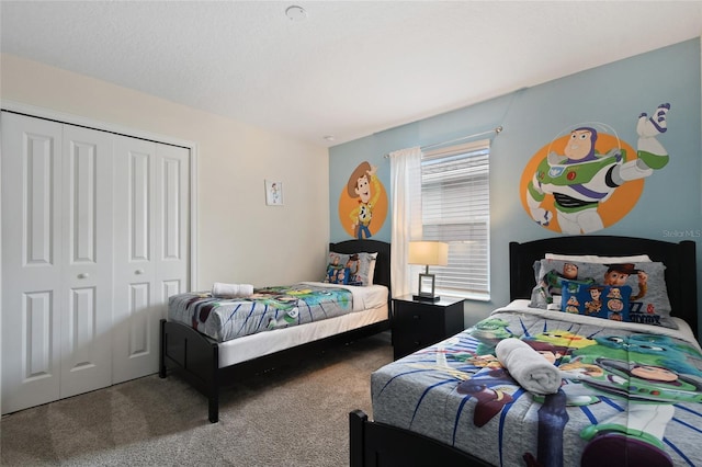 carpeted bedroom with a closet