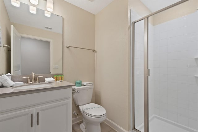 bathroom with vanity, toilet, and walk in shower