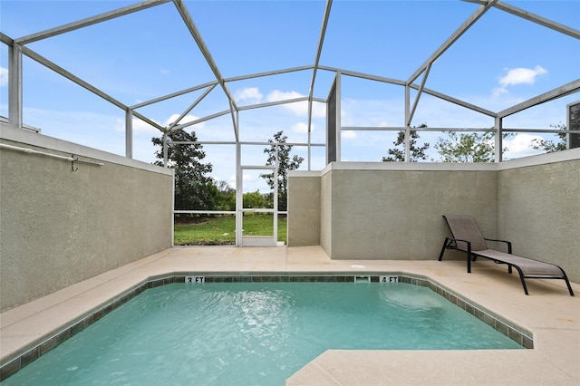 view of pool with a lanai and a patio area