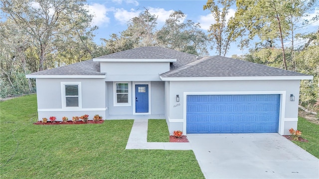 view of front of home with a garage and a front yard