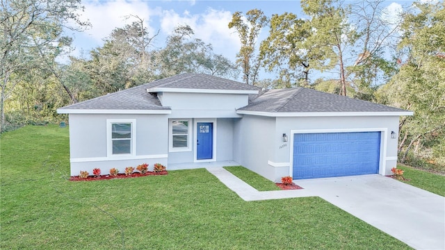 view of front facade with a garage and a front lawn