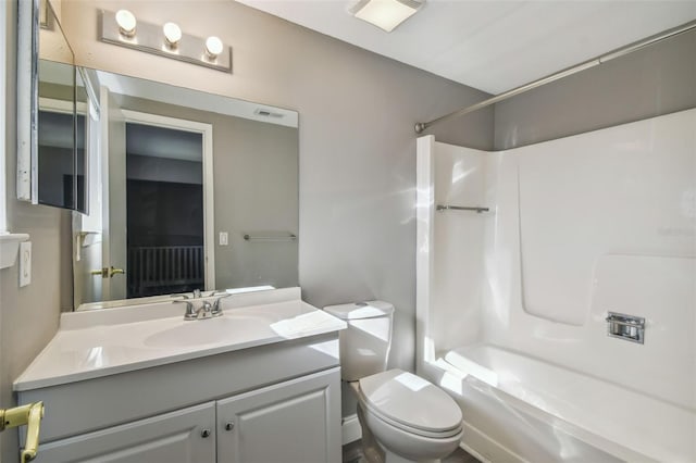 full bathroom featuring toilet, vanity, and bathing tub / shower combination