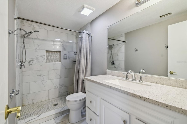 bathroom featuring toilet, a shower with shower curtain, a textured ceiling, and vanity