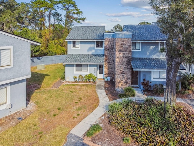 front facade with a front yard