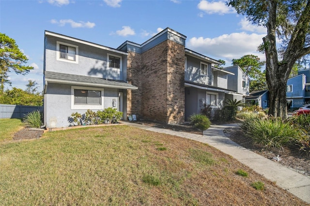 view of front of home featuring a front lawn