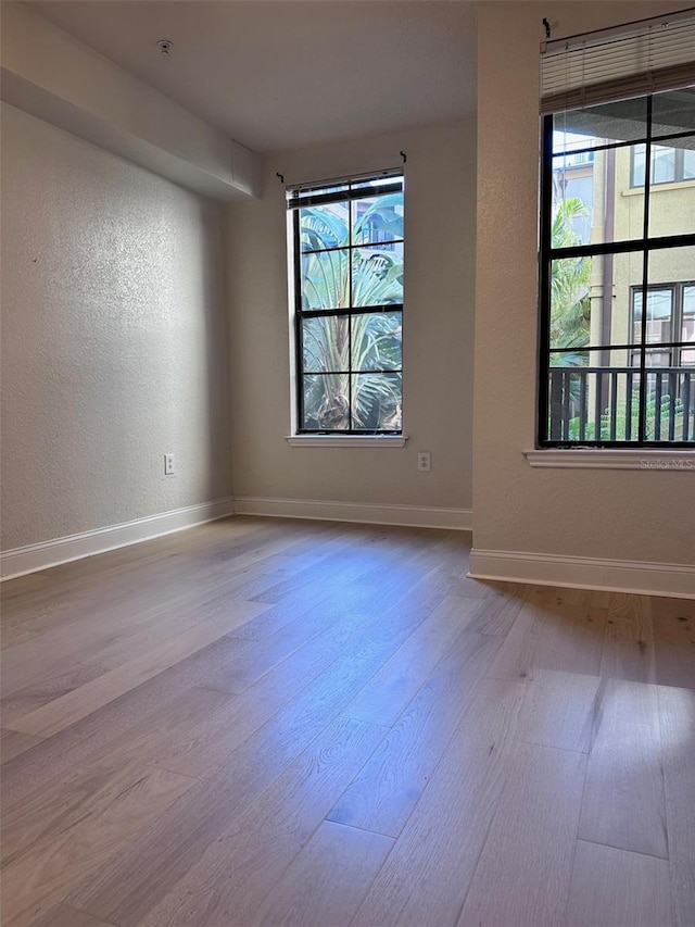 unfurnished room featuring light hardwood / wood-style flooring