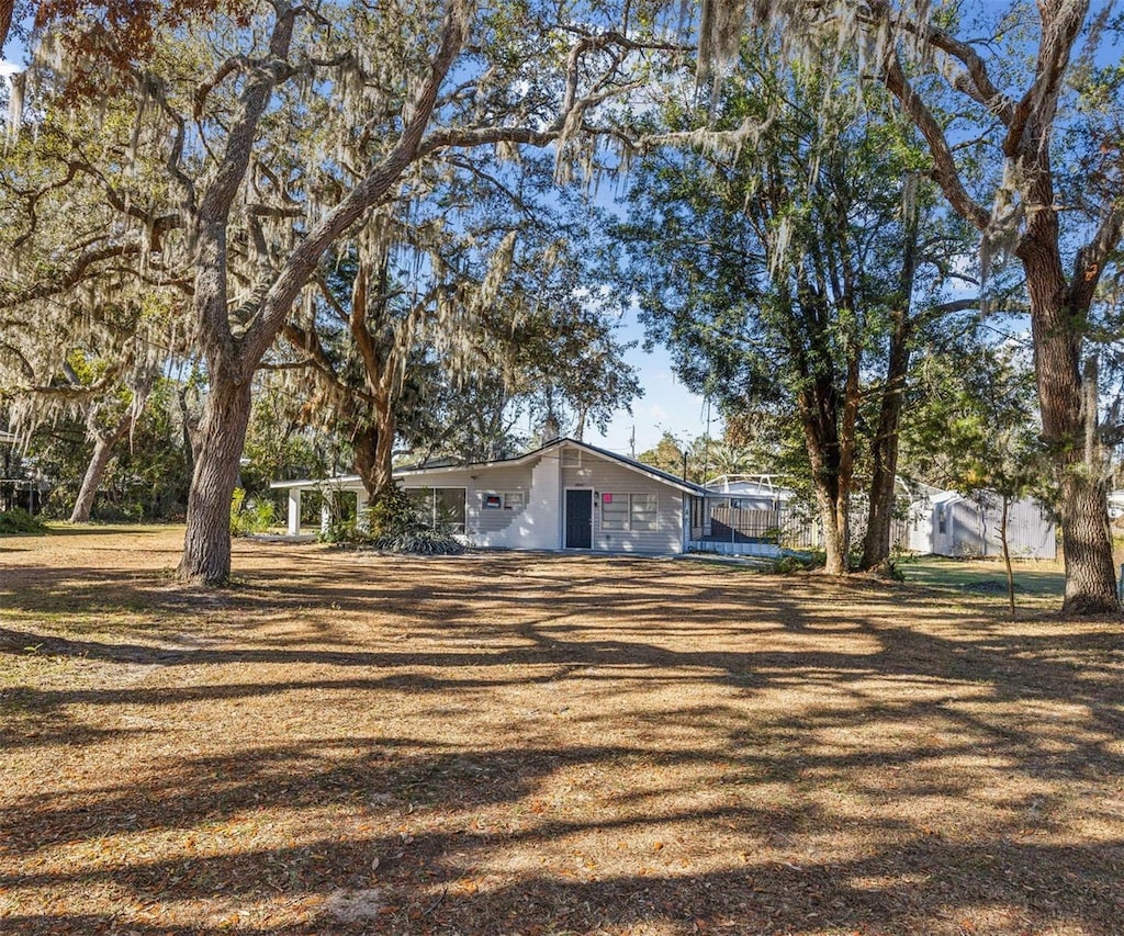 single story home featuring a trampoline