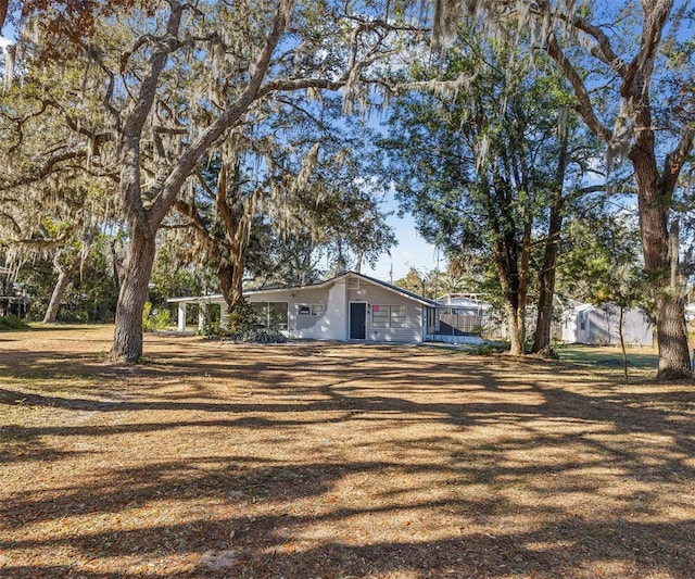 single story home featuring a trampoline