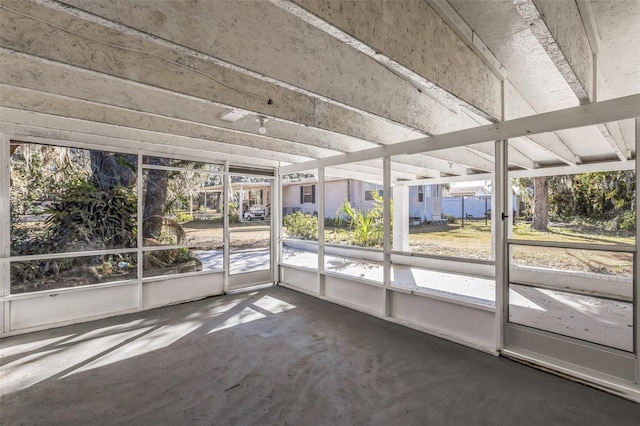 unfurnished sunroom featuring a healthy amount of sunlight