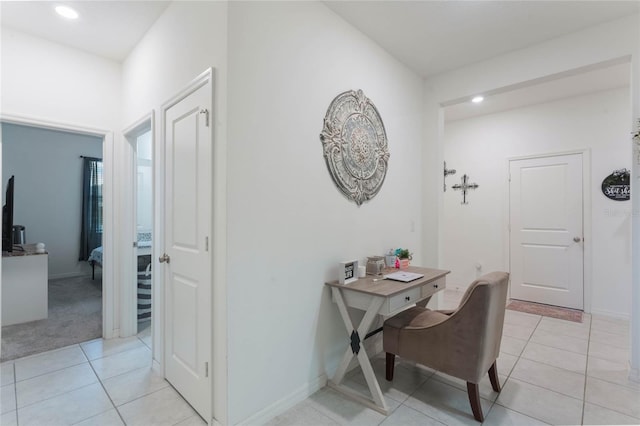 corridor featuring light tile patterned floors