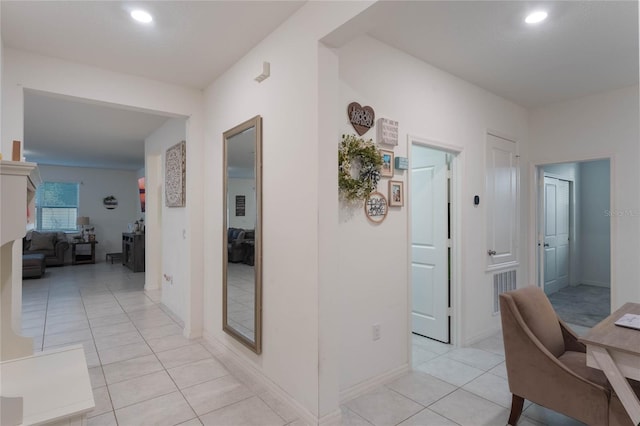 hall featuring light tile patterned floors