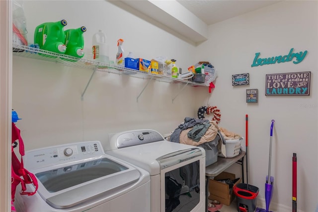 clothes washing area featuring washing machine and clothes dryer