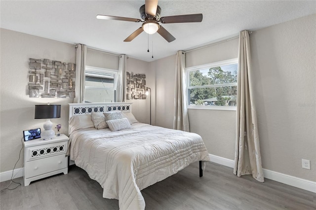 bedroom featuring hardwood / wood-style floors and ceiling fan