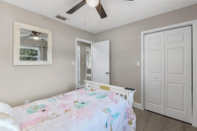 bedroom featuring ceiling fan, a closet, and hardwood / wood-style flooring