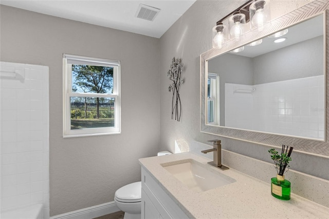 full bathroom with vanity, tub / shower combination, and toilet