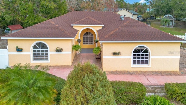 mediterranean / spanish-style home with a patio