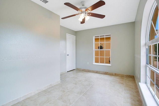 unfurnished room featuring ceiling fan