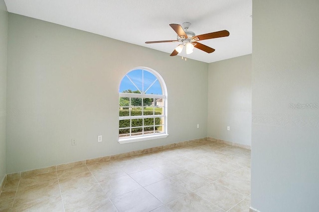 unfurnished room with ceiling fan