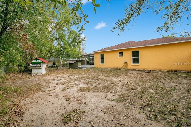 view of yard featuring a sunroom