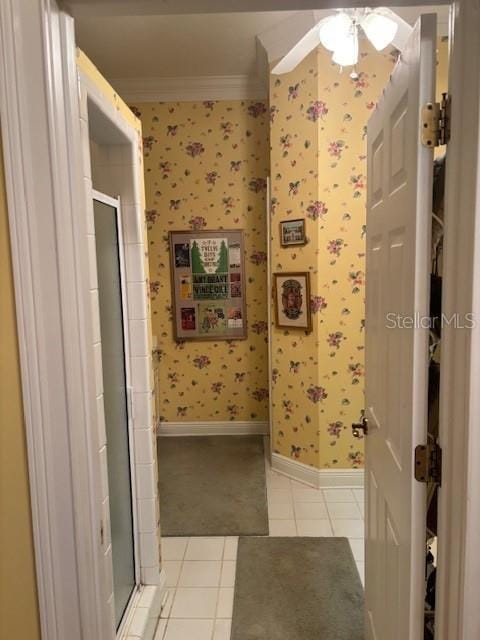 bathroom with tile patterned floors and ornamental molding