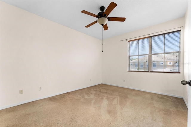 unfurnished room featuring ceiling fan and light colored carpet