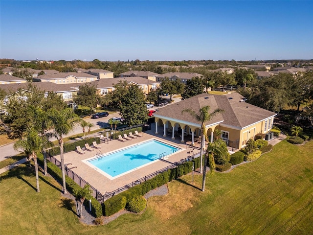 view of swimming pool with a yard and a patio area