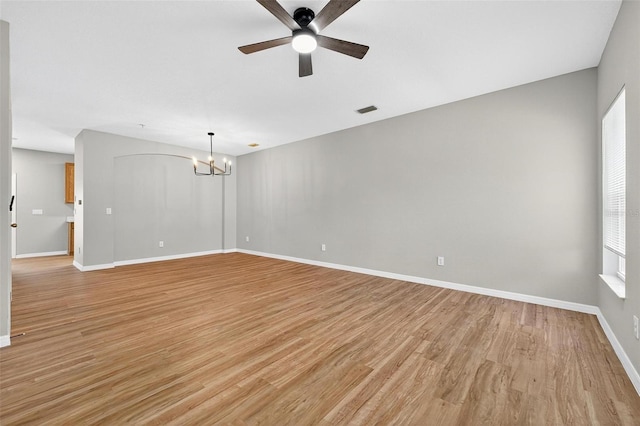 13228 Daniels Landing Cir, Winter Garden, FL 34787 - spare room featuring a chandelier, light wood-style floors, and ceiling fan