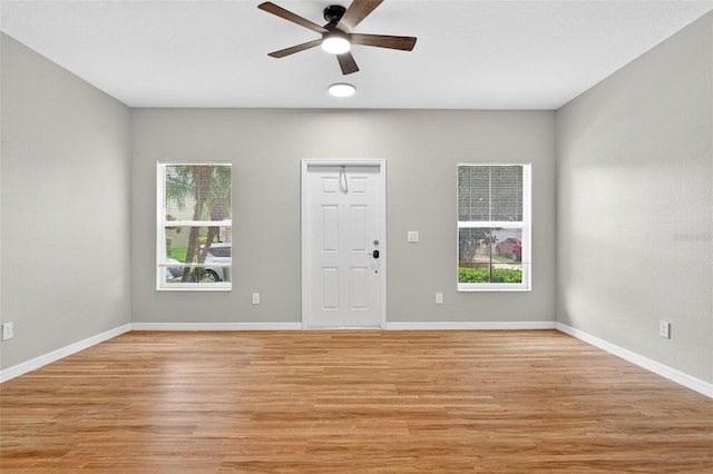 13228 Daniels Landing Cir, Winter Garden, FL 34787 - entryway featuring ceiling fan, plenty of natural light, and light wood-style flooring