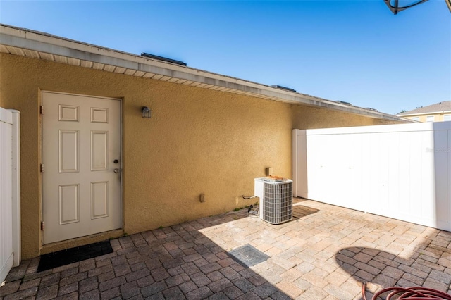 13228 Daniels Landing Cir, Winter Garden, FL 34787 - view of exterior entry featuring stucco siding and a patio area